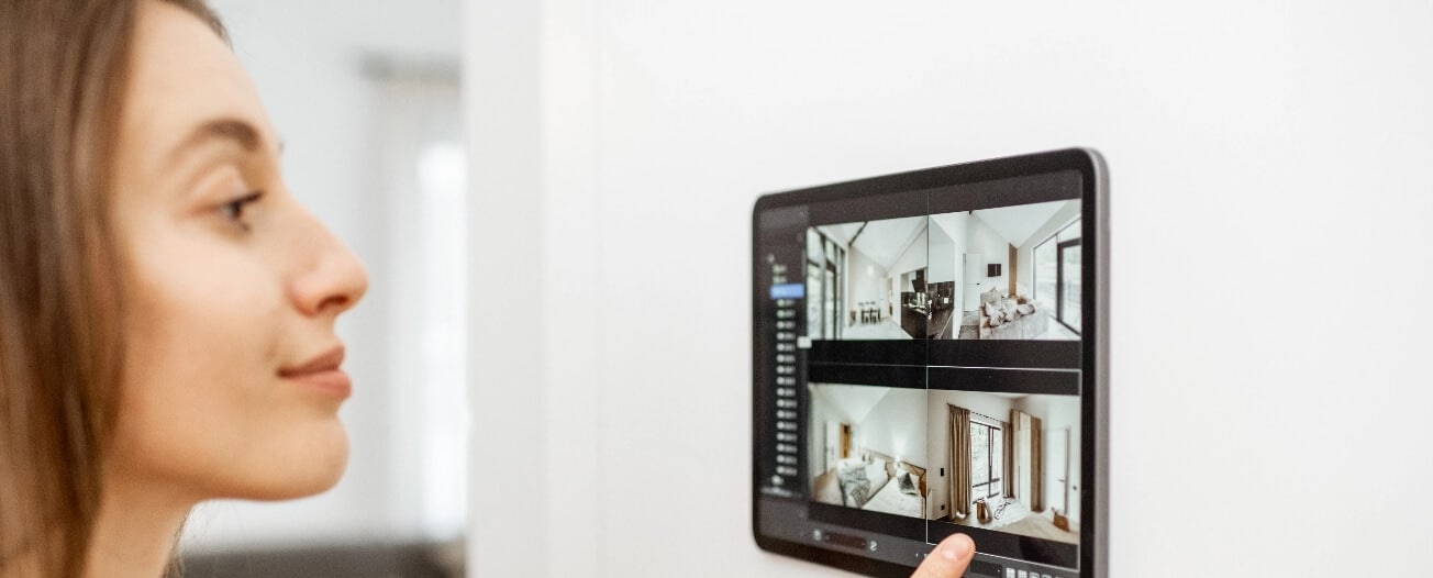 homeowner-enjoying-smart-home-automation Homeowner enjoying smart home automation and entertainment system